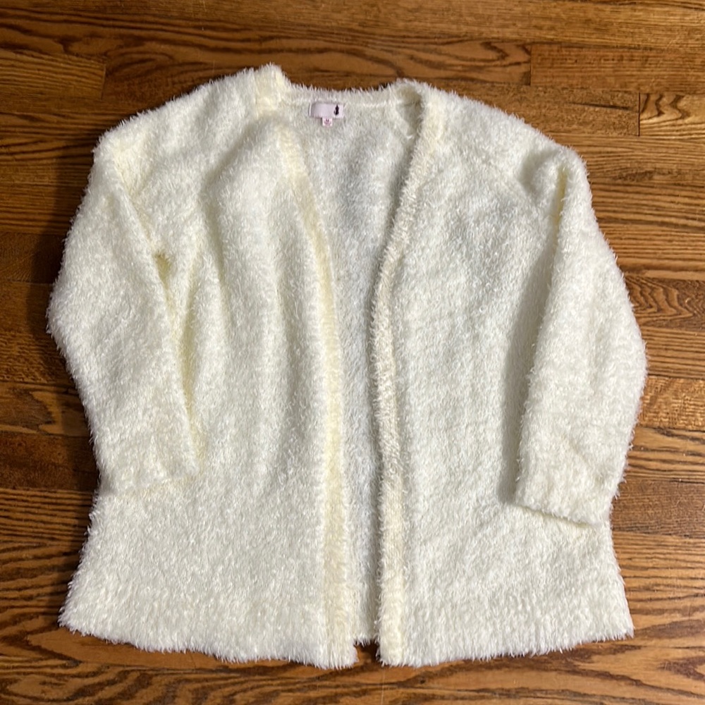 Off white color cardigan.